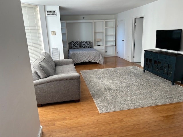 bedroom with hardwood / wood-style floors