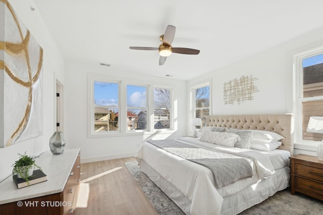 bedroom featuring light hardwood / wood-style floors and ceiling fan