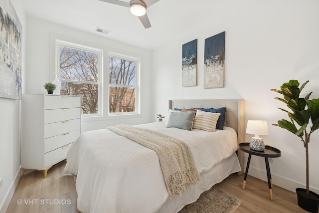 bedroom with ceiling fan and light hardwood / wood-style flooring