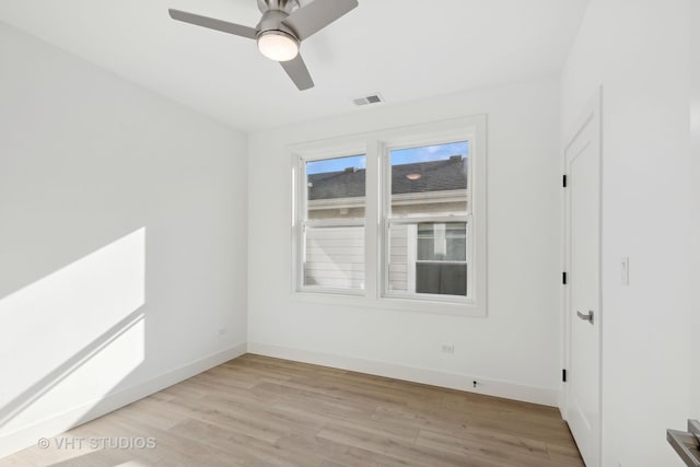 spare room with light hardwood / wood-style floors and ceiling fan