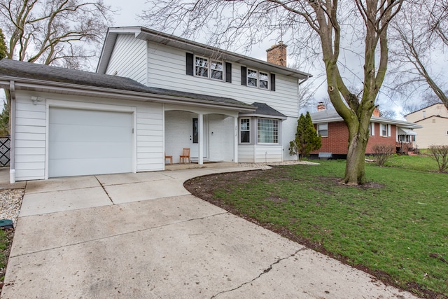 view of property with a garage and a front yard