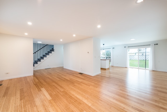 spare room featuring light hardwood / wood-style flooring