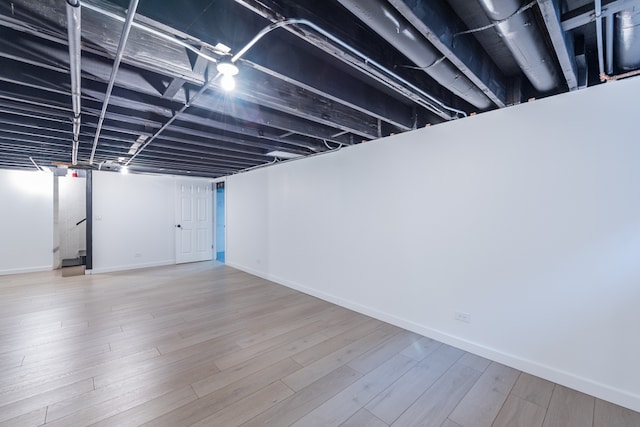 basement featuring light wood-type flooring