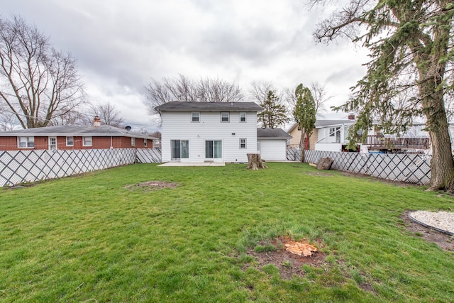 rear view of house with a patio area and a lawn