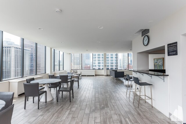 dining space with light hardwood / wood-style flooring