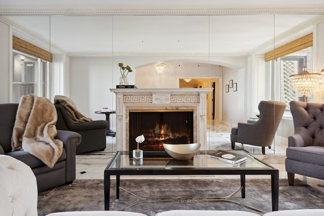 living room featuring a chandelier, tile flooring, and a fireplace