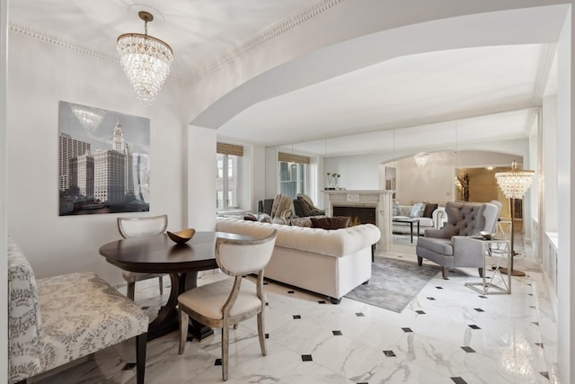 tiled living room with a notable chandelier and a premium fireplace