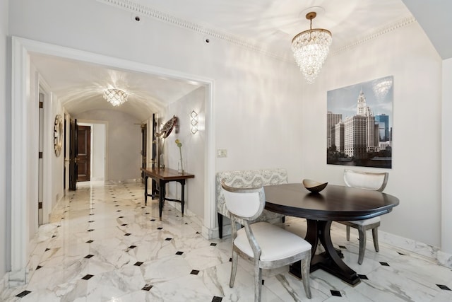 tiled dining space featuring an inviting chandelier