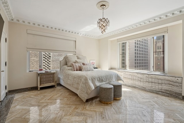 bedroom featuring multiple windows, crown molding, and light parquet flooring