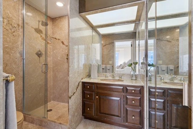 bathroom with walk in shower, vanity, toilet, and tile flooring