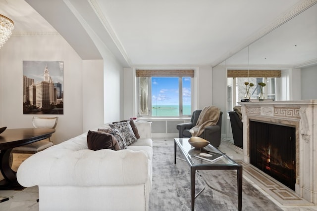 living room with a fireplace and crown molding