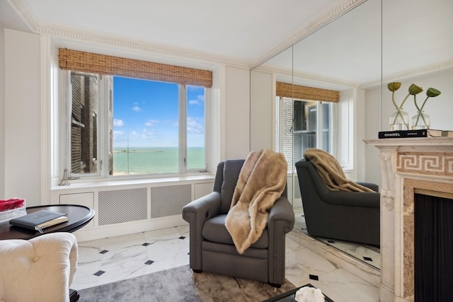 living area featuring tile flooring and a water view