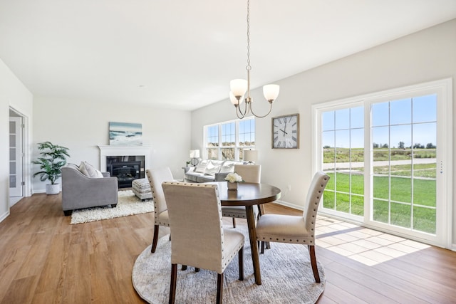 dining room featuring light hardwood / wood-style flooring and an inviting chandelier