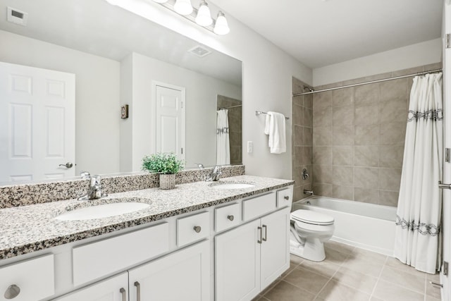 full bathroom featuring tile patterned floors, shower / bath combination with curtain, toilet, and vanity