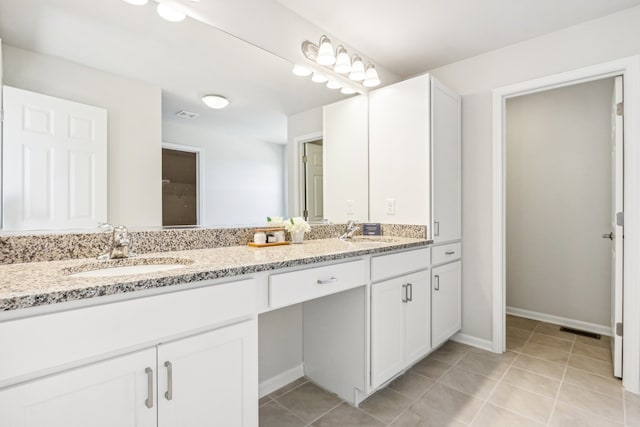 bathroom with vanity and tile patterned floors