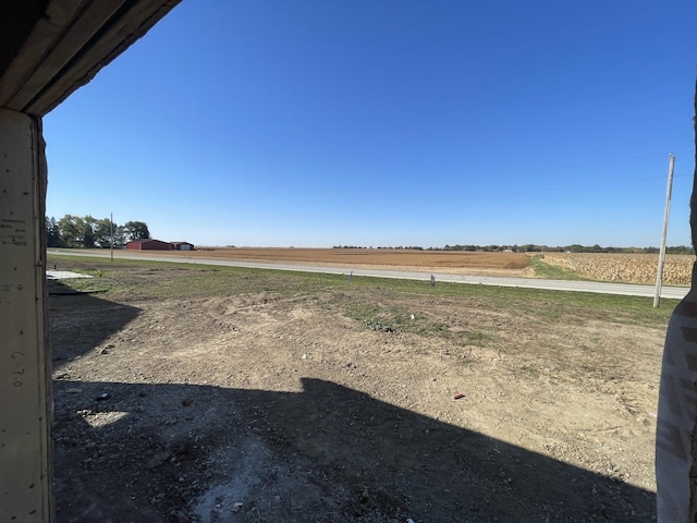 view of yard with a rural view