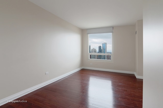 empty room featuring dark hardwood / wood-style floors