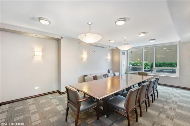 dining space with light colored carpet