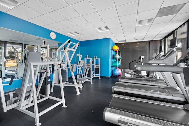 workout area with a drop ceiling