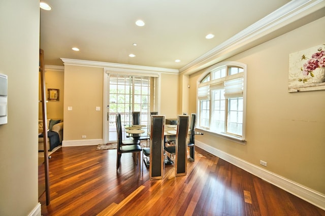 dining space featuring dark hardwood / wood-style floors and crown molding