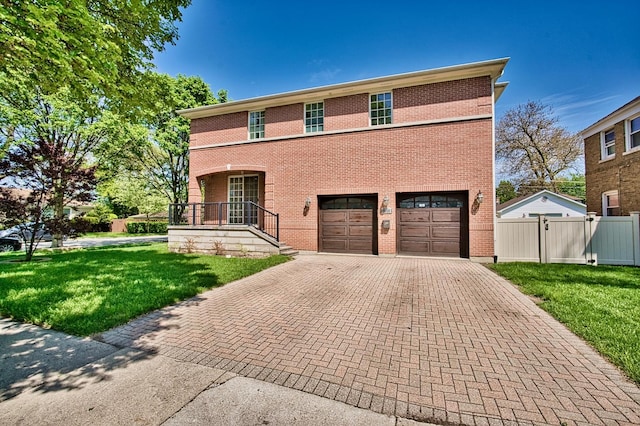 view of front of house featuring covered porch, a garage, and a front yard