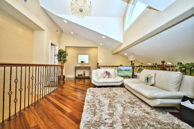 living room featuring a skylight, high vaulted ceiling, dark wood-type flooring, and a notable chandelier