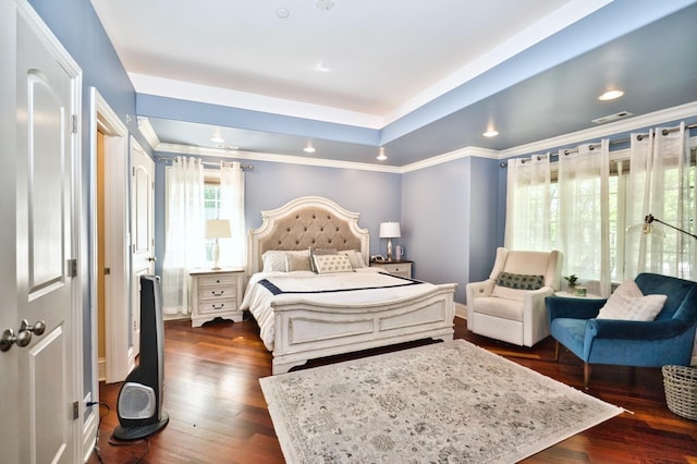 bedroom with dark hardwood / wood-style floors and crown molding