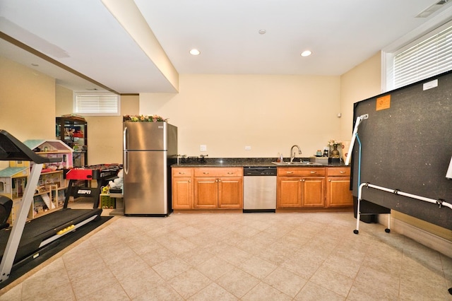 kitchen with sink and appliances with stainless steel finishes