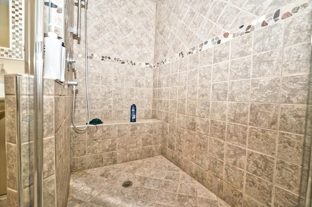 bathroom with tiled shower