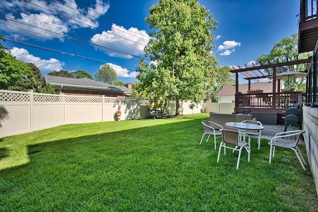 view of yard featuring a pergola and a wooden deck