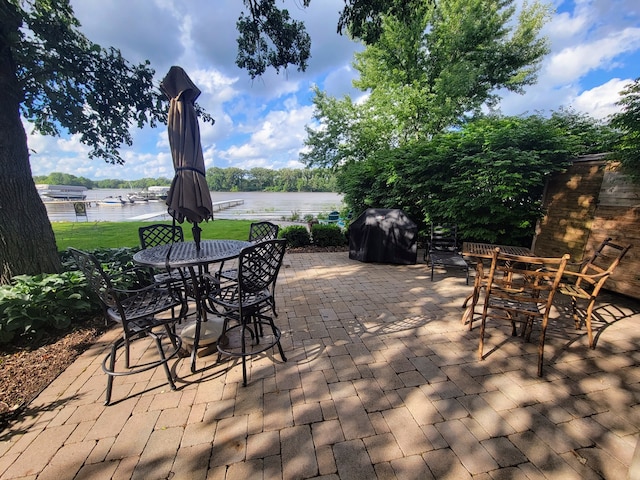 view of terrace with a water view