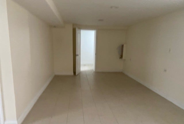 spare room featuring tile flooring