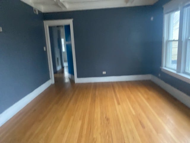 empty room featuring hardwood / wood-style flooring