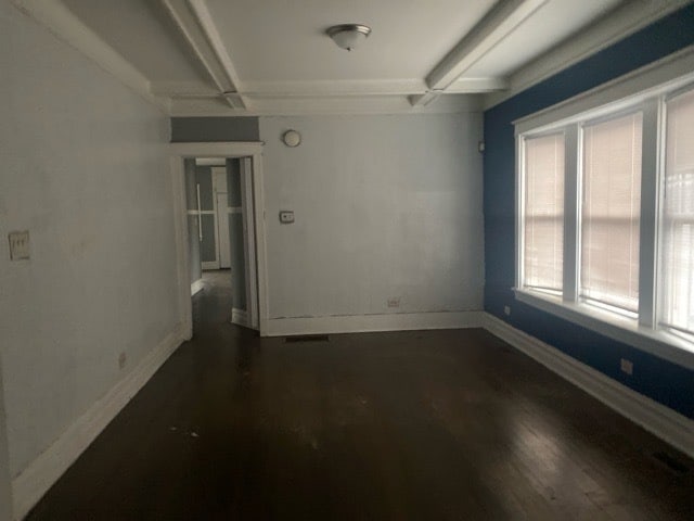 empty room featuring dark hardwood / wood-style flooring