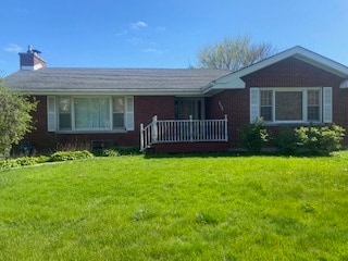 ranch-style home with a front yard