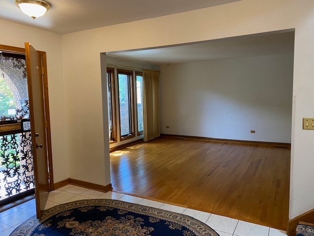 foyer with a wealth of natural light and light tile patterned floors