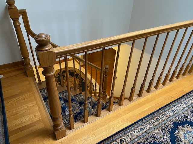 stairway featuring hardwood / wood-style flooring