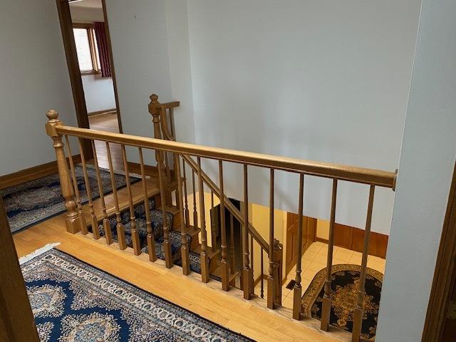 stairway featuring hardwood / wood-style floors