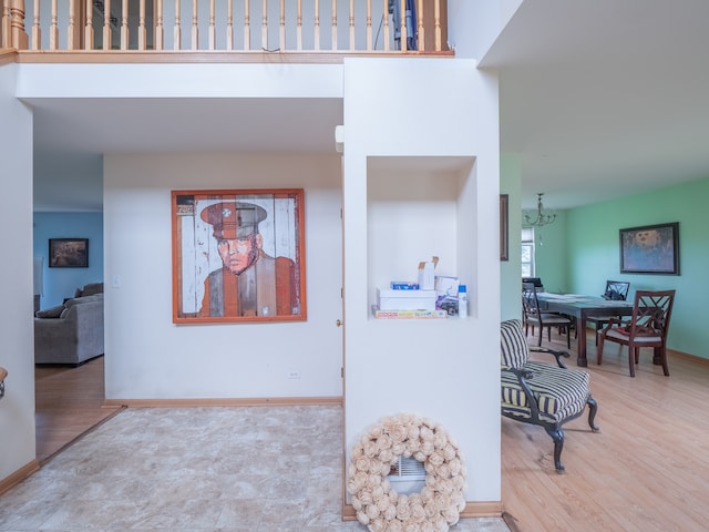 interior space with a notable chandelier and light tile flooring