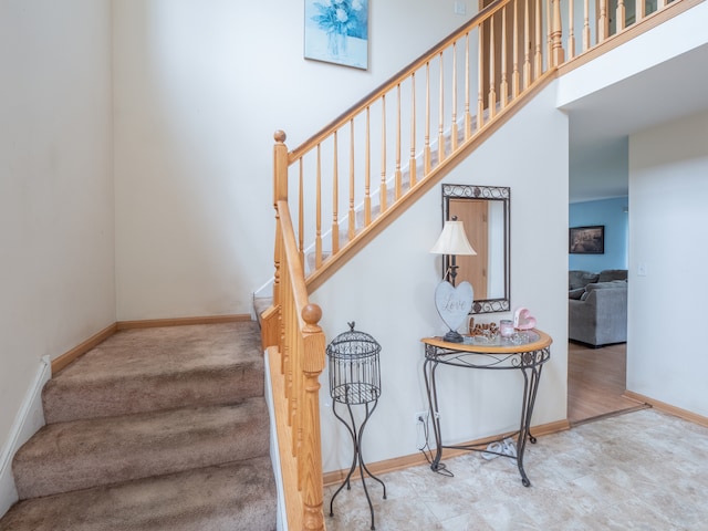 stairway featuring tile flooring