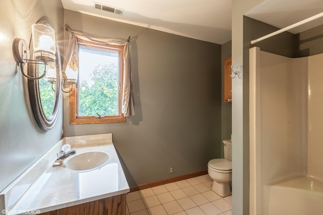 bathroom with walk in shower, tile patterned floors, vanity, and toilet