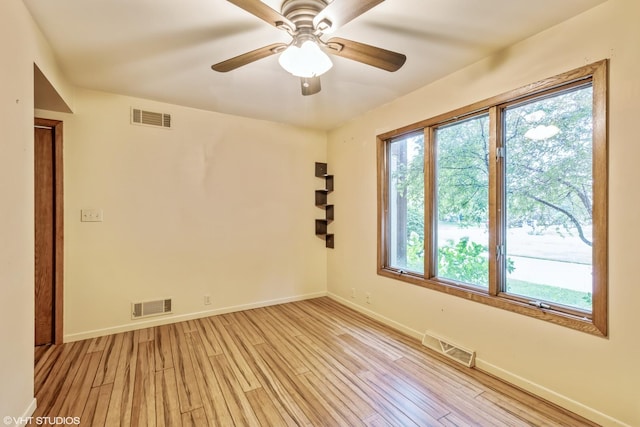 spare room with ceiling fan and light hardwood / wood-style flooring