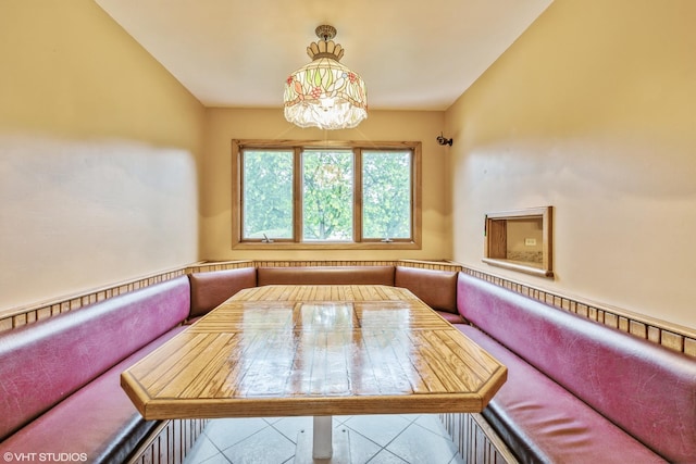 tiled dining area featuring breakfast area