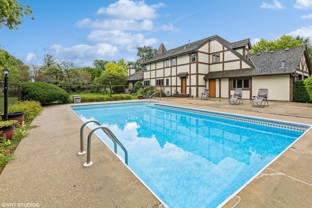 view of pool featuring a patio