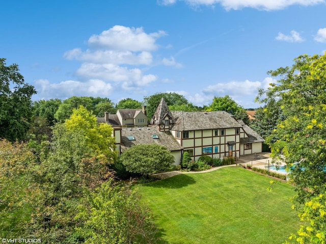 rear view of house with a lawn