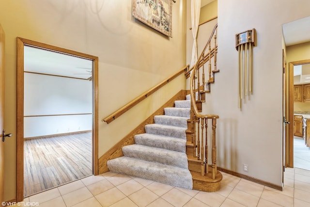 stairway with tile patterned floors