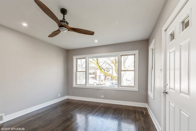 empty room featuring hardwood / wood-style floors and ceiling fan