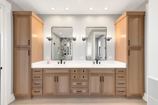 bathroom featuring tile flooring and dual vanity