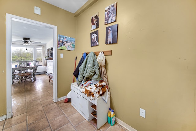 mudroom featuring tile flooring and ceiling fan