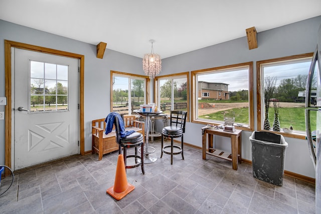 interior space with tile flooring and a chandelier